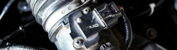 Close up of automotive mass airflow sensor on air intake manifold