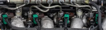 Close up of fuel injectors and common rail in a diesel engine
